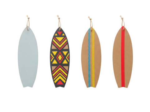 Miniature wooden surfboard cutouts with colorful patterns isolated on transparent background