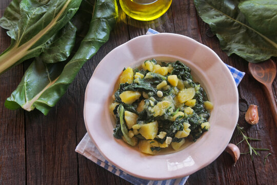 Traditional Croatian Blitva - Swiss Chard with Potatoes, Garlic and Olive Oil, Dalmatian Cuisine.

 "Blitva na leso", a classic Croatian and Mediterranean side dish made of boiled Swiss chard, cubed p
