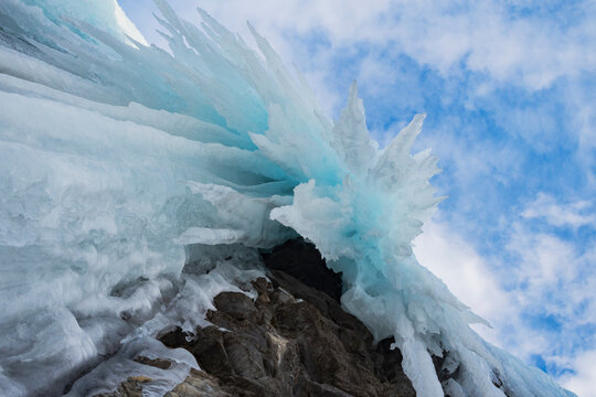 Frozen Waterfall with jagged ice formations below in nordkjosbotn