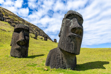 Moai Tukuturi at Rano Rarakuon easter island. Beautiful Moai Statues with beautiful blue sky in the background and green gras in the foreground  © Sven Taubert