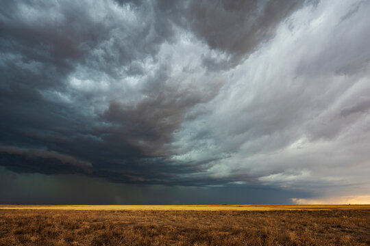 Storm Cell with dark clouds over dry field in dumas texas