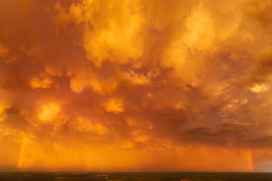 Rainbow under dramatic storm clouds at Sunset over Uvalde texas