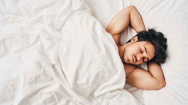 young man sleeping peacefully in a cozy bed