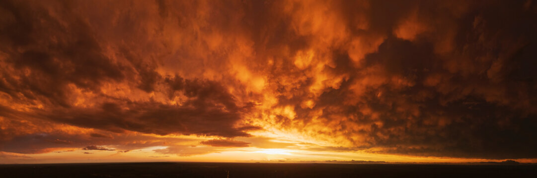 Sunset with dramatic storm clouds over Uvalde landscape