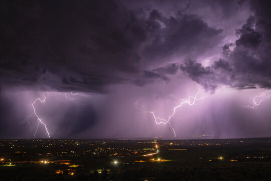Lightning striking over sierra vista under stormy skies at night