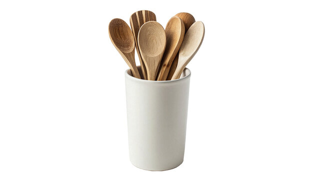 White ceramic cup filled with wooden kitchen spoons and utensils