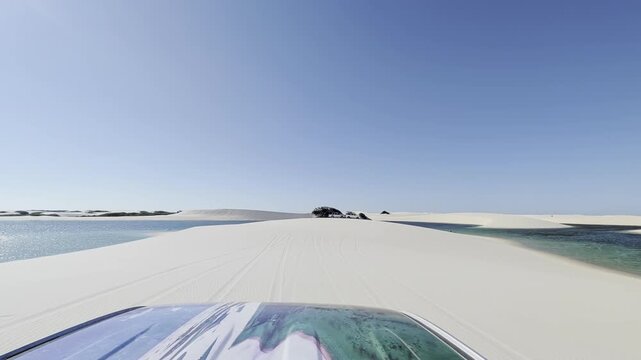 View of white sand dunes and turquoise lagoons at Parque Nacional dos Lencois Maranhenses in MA, Brazil.