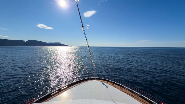 Bright sunny day from a cruise ship bow with sparkling ocean water