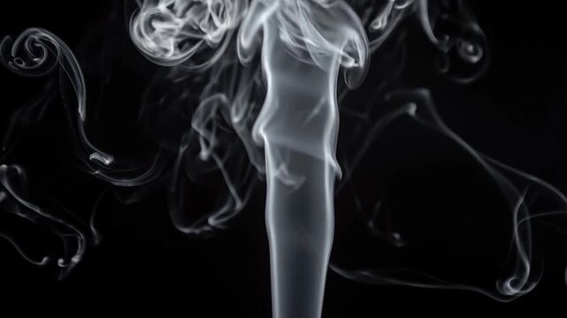 Intricate white smoke patterns twisting and billowing against a dark background