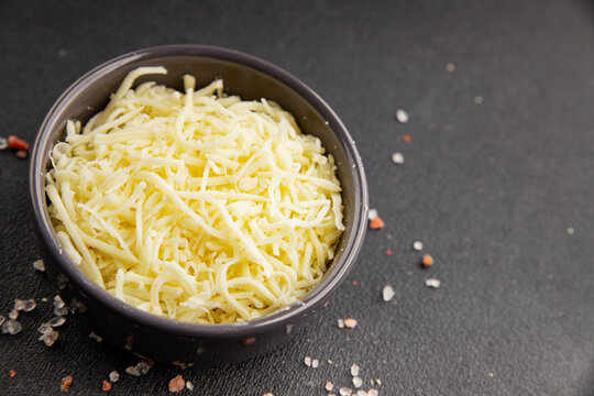 Grated cheese shredded mozzarella serving size ingredients healthy eating  snack fresh gourmet rustic food background on the table top view copy space