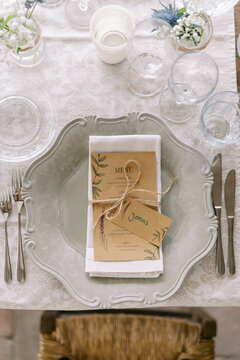 Elegant wedding dinner table setting with menu and name card