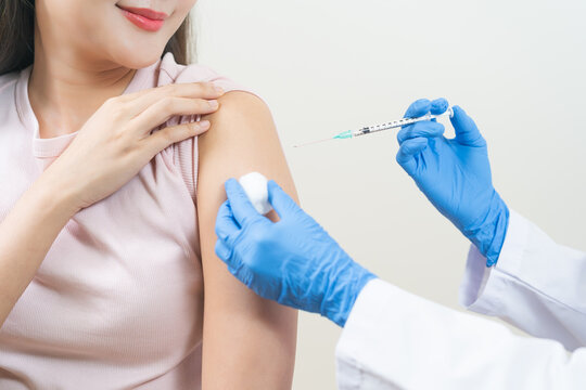 Health care, corona virus, hand of woman nurse, doctor giving syringe vaccine, injection dose on arm sick patient at clinic. Vaccination, immunization disease prevention against flu pandemic influenza
