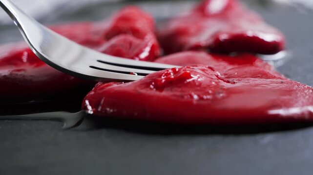 Close up of Pimientos del piquillo, small sweet red peppers traditionally grown in the Spanish region of Navarre.