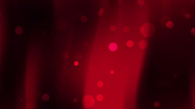 Red bokeh circles on a red black gradient background perfect for abstract designs, festive concepts, and holidaythemed projects.