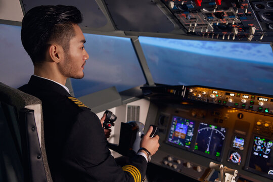 Airline Pilot Flying Modern Airplane in Cockpit