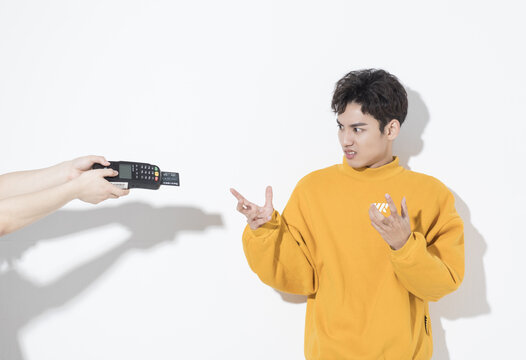 Shocked Young Man Refusing Card Payment at Terminal