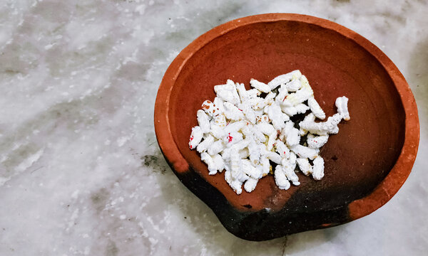 Traditional Indian Puffed Rice Kheel in Clay Diya for Diwali Puja
