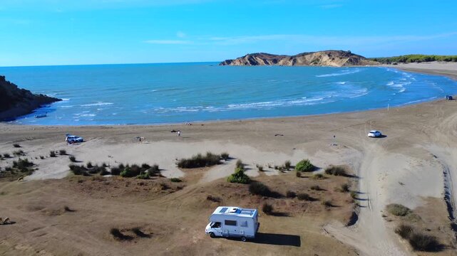 Campervan on Dalan Beach Albania Aerial Drone Shot 4K