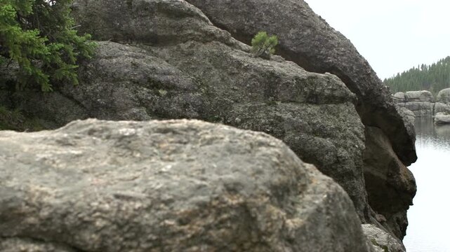 Rocks in mountain pan to lake
