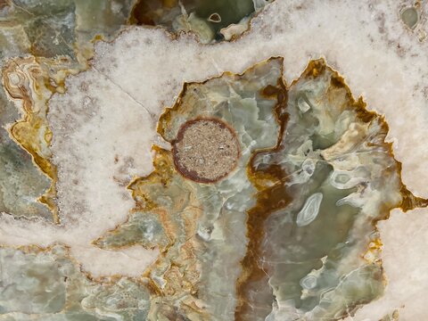Polished green onyx marble texture, featuring natural white and cream crystalline veining.