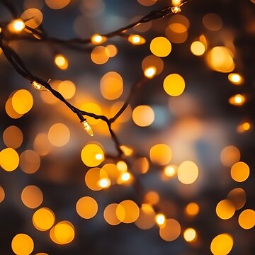 Warm golden string lights create a blurred bokeh effect ideal for festive and cozy seasonal themes