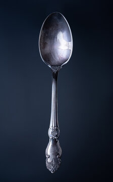 Silver spoon close up  on a black background