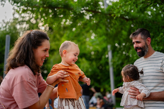family playing with children in outdoor park