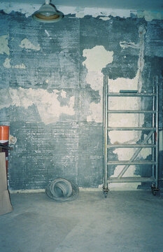 Folded Scaffold in an Empty Room Under Renovation