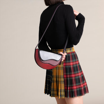Fashion Model Wearing Plaid Skirt And Handbag