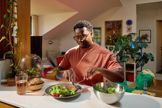 Man eats at home alone