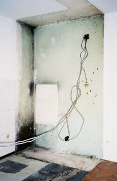 Exposed Electrical Wires Hanging on Wall During Renovation