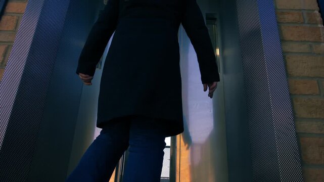 Women gets into lift elevator as doors open