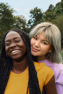 Friends smiling bonding outdoors