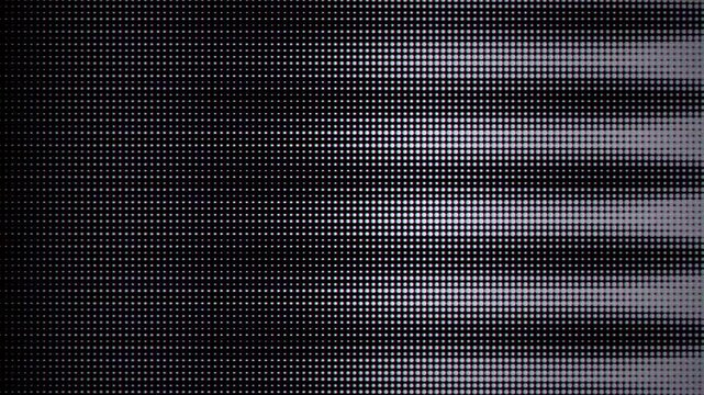 Abstract pixelated gradient pattern with colorful dots transitioning smoothly