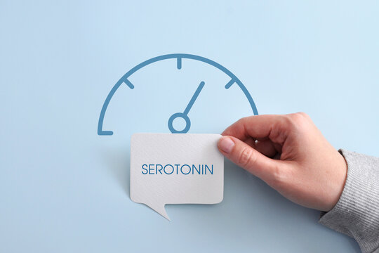 Serotonin level indicator on a blue background. High serotonin level in the blood.