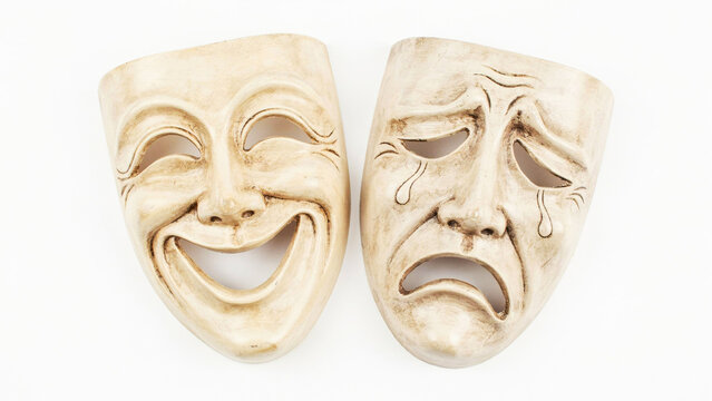 Classic theater comedy and tragedy masks depicting contrasting emotions of happiness and sorrow