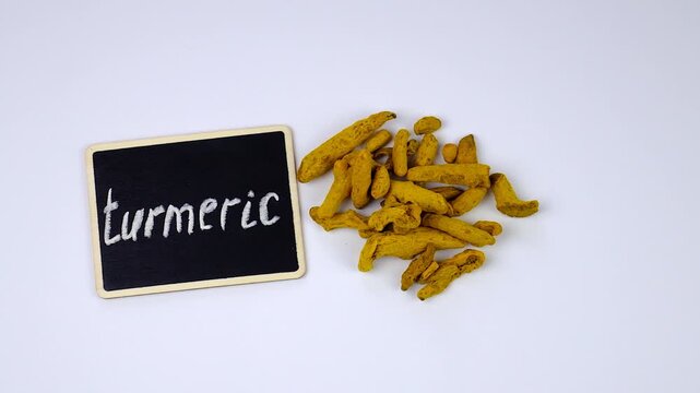 Turmeric root for supplements and essential oils. Selective focus.