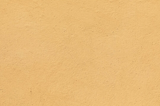 yellow plaster wall in rough structure