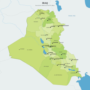 Detailed administrative map of iraq showing governorates, cities, rivers, and borders in green tones