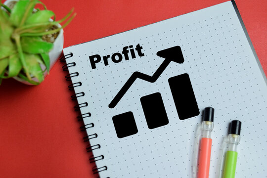 Concept of profit growth financial graph write on book isolated on table. For investment analysis and revenue increase