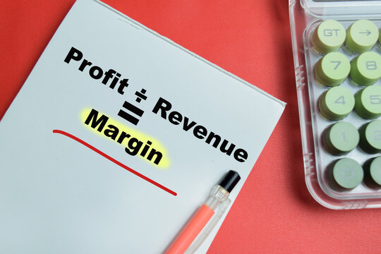 Concept of profit margin formula divided by revenue write on book isolated on table. For financial accounting and business analysis