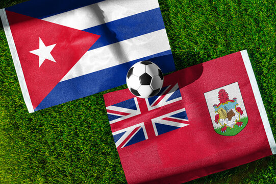 Cuba vs. Bermuda football match. National flags on green grass with soccer ball in the middle. Football background for international match.