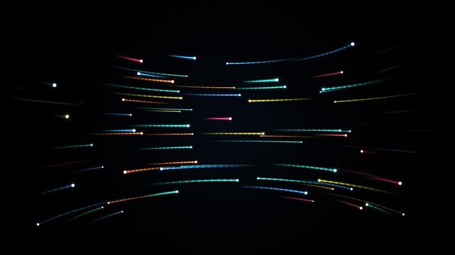 Abstract streaks of colorful light particles moving rapidly across a dark background suggesting speed and data flow