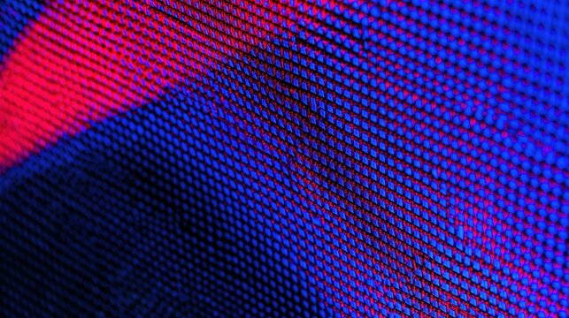 Led screen texture with a grid of glowing pixels in blue and red, vivid electric colors for digital design and tech backgrounds