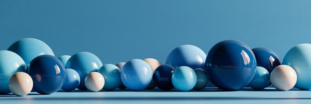 Blaue Kugeln in verschiedenen Gr&ouml;&szlig;en auf blauem Hintergrund