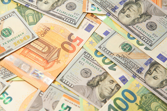 Top view of euro banknotes and US dollar