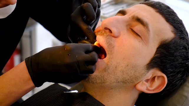 A man at a dentist appointment. Selective focus.