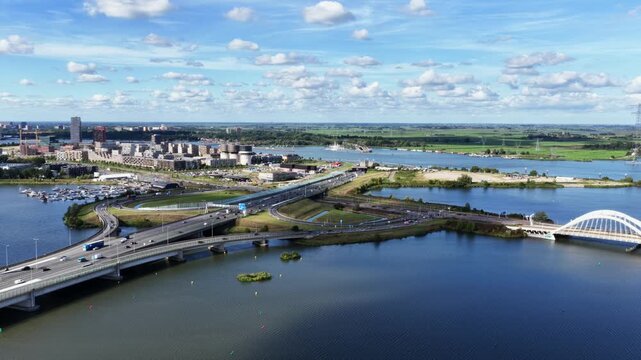 Aerial view of highway A10, Zeeburgereiland and Enneus Heerma Bridge in Amsterdam