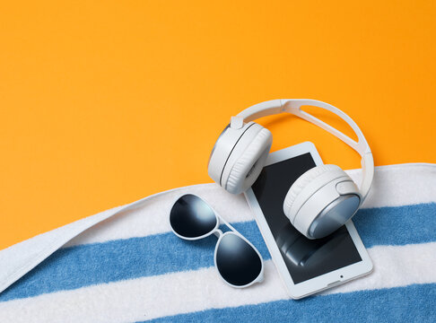 Summer Beach Essentials with Headphones, Sunglasses and Digital Tablet