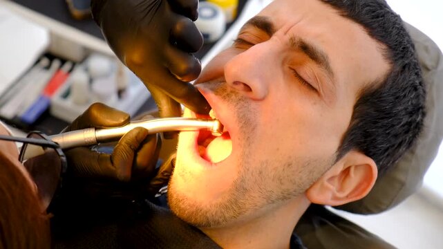 A man at a dentist appointment. Selective focus.